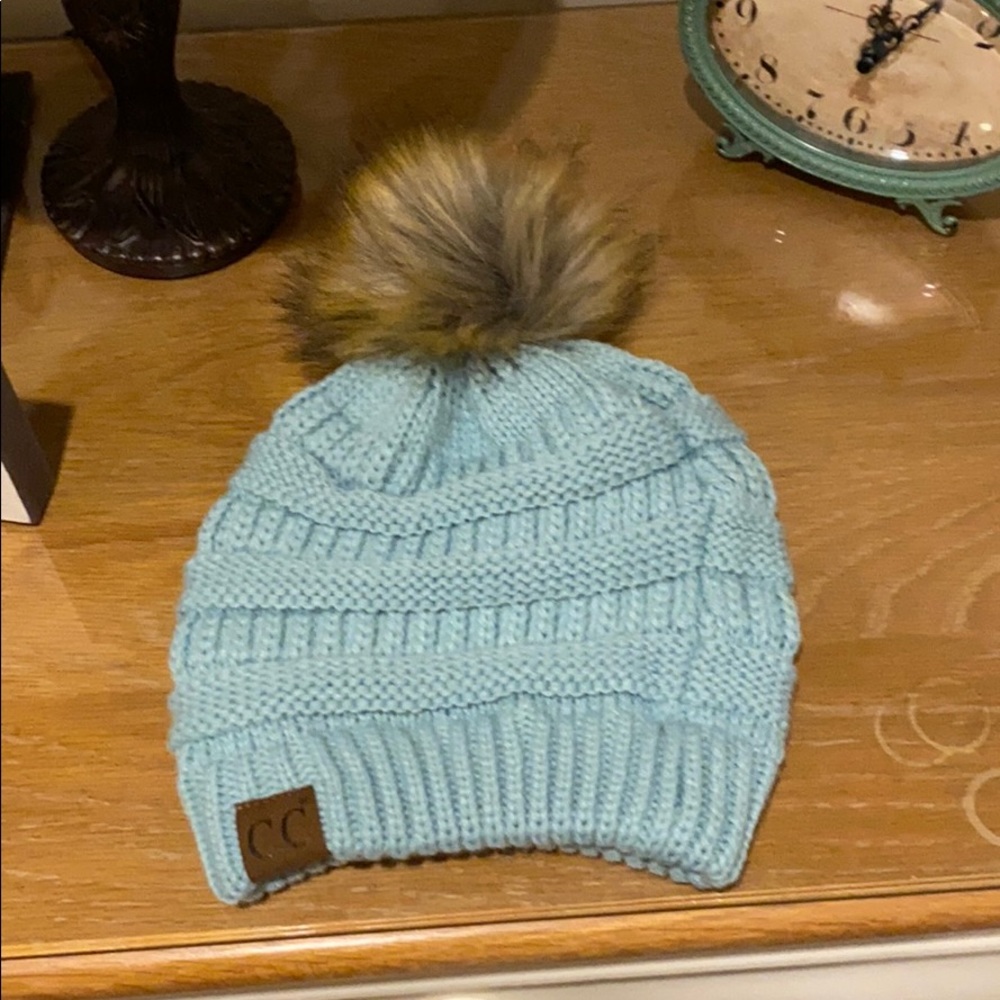 NWOT CC aqua knit hat with tan Pom Pom.